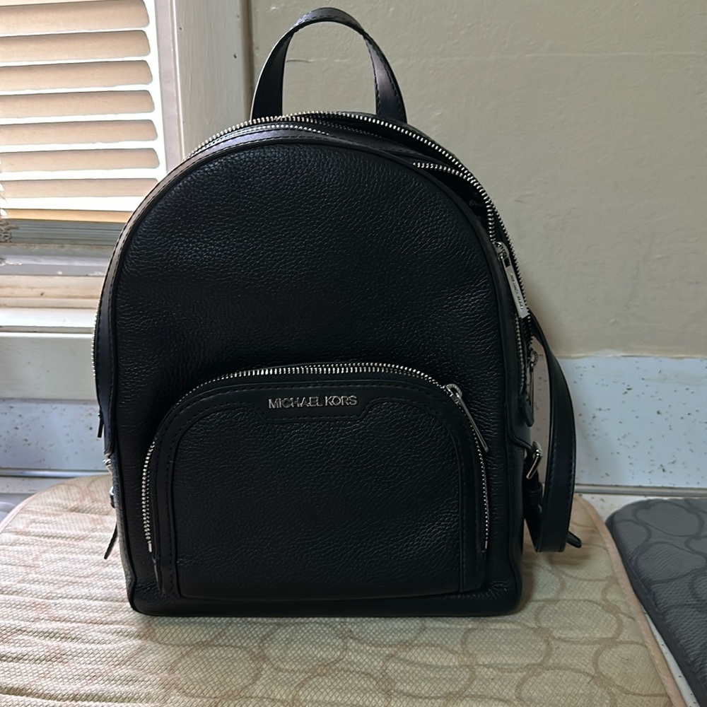Michael Kors backpack purse- size medium.-  used a few times. Too small for me
